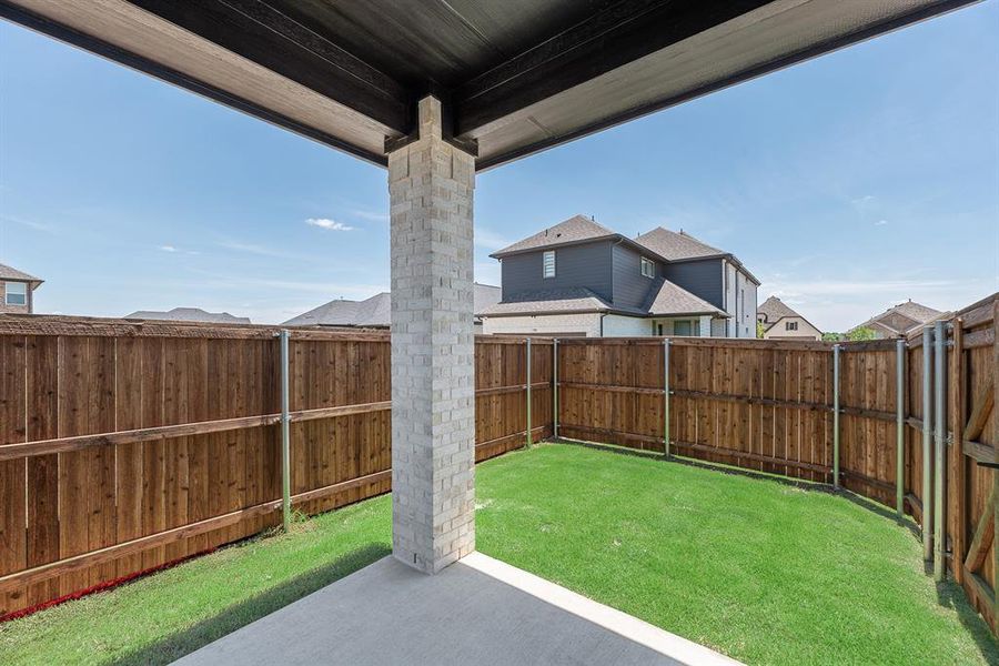 Fenced backyard featuring a patio Fenced backyard featuring a patio