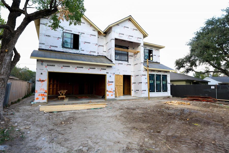 *Construction Progress Photo taken 11/20* Metal Accent Roof above garage & Study. Designer landscaping will be installed upon home completion.
