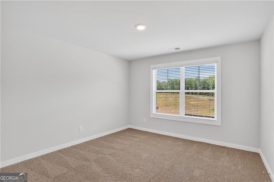Spacious, unfurnished interior of a new home in The Fairways at Mirror Lake, Villa Rica (Image 60).