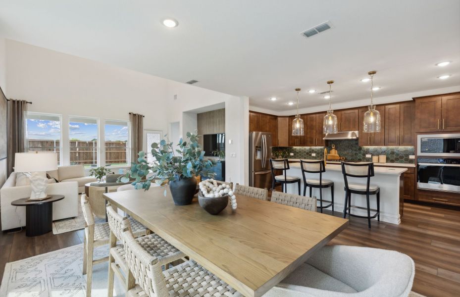 Spacious dining area with view of kitchen