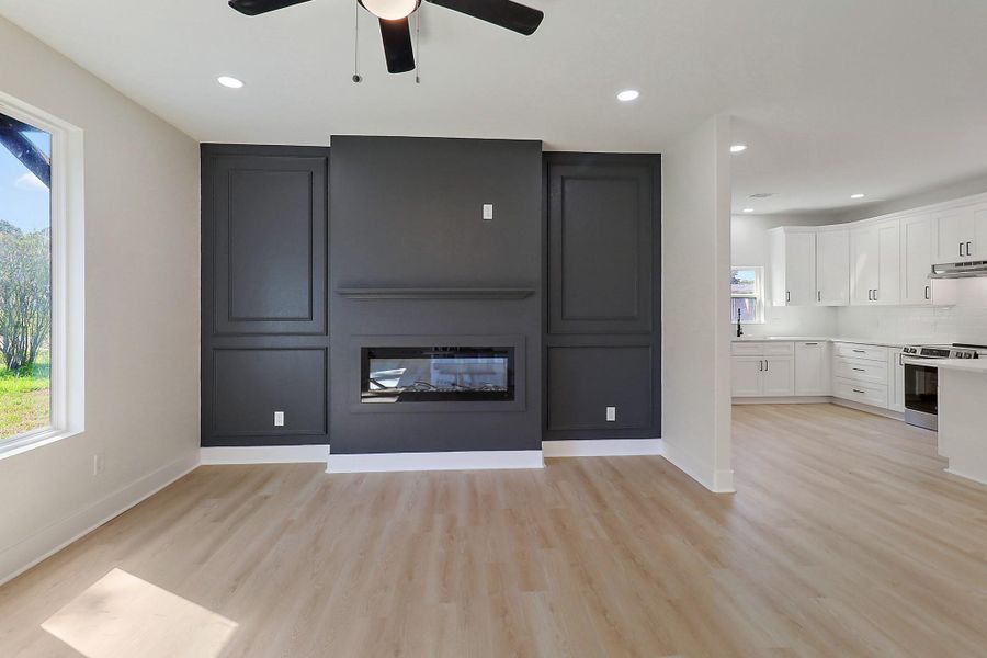 This feature wall matching the stunning exterior color holds your fireplace.