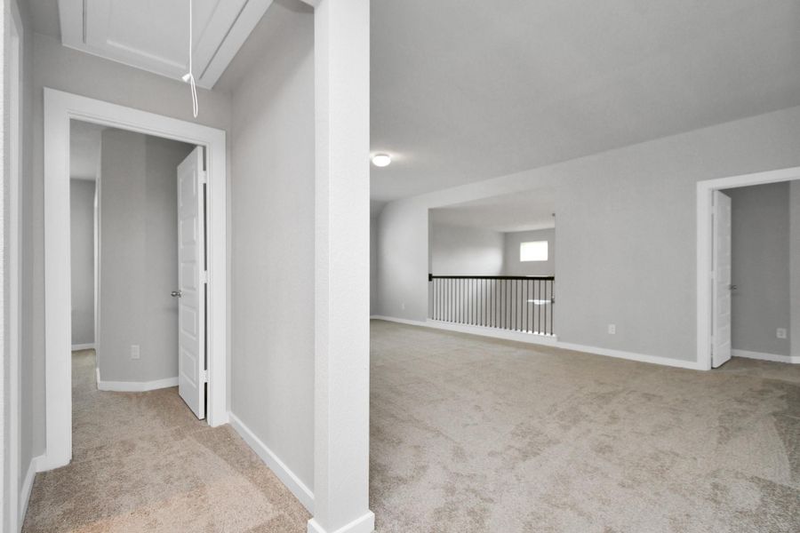 Ascend up stairs to the large game room and all secondary beds and baths. Sample photo of completed home with similar floor plan. Actual colors and selections may vary.