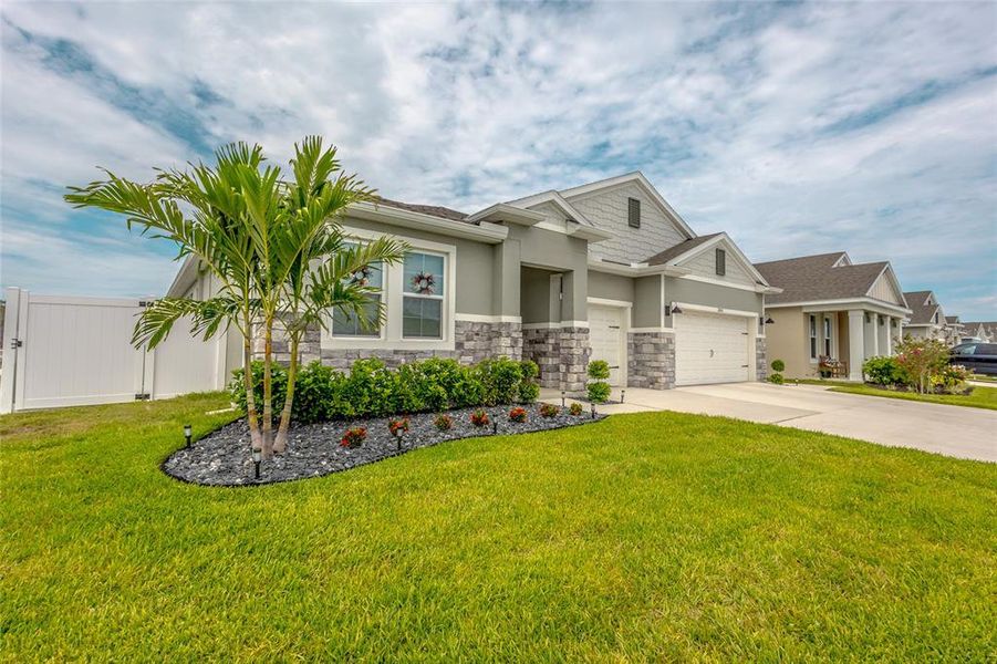 Front exterior of a new home in Harmony West, Harmony, FL, highlighting curb appeal (Image 23). Front exterior of a new home in Harmony West, Harmony, FL, highlighting curb appeal (Image 23).