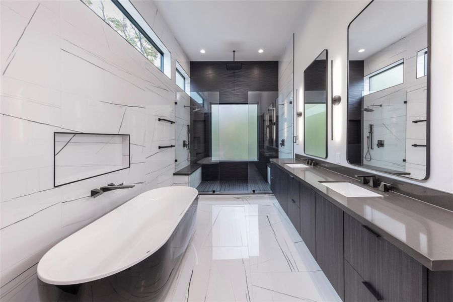 Example of Builders previously built home with similar finishes. Primary suite bathroom clad in polished porcelain from floor to ceiling, designed to evoke a luxurious spa atmosphere. Example of Builders previously built home with similar finishes. Primary suite bathroom clad in polished porcelain from floor to ceiling, designed to evoke a luxurious spa atmosphere.