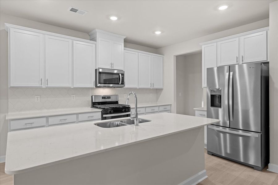 Furnished interior view inside a new home in The Farm at Wells Creek - Signature Collection, Gray Court (Image 4). Furnished interior view inside a new home in The Farm at Wells Creek - Signature Collection, Gray Court (Image 4).