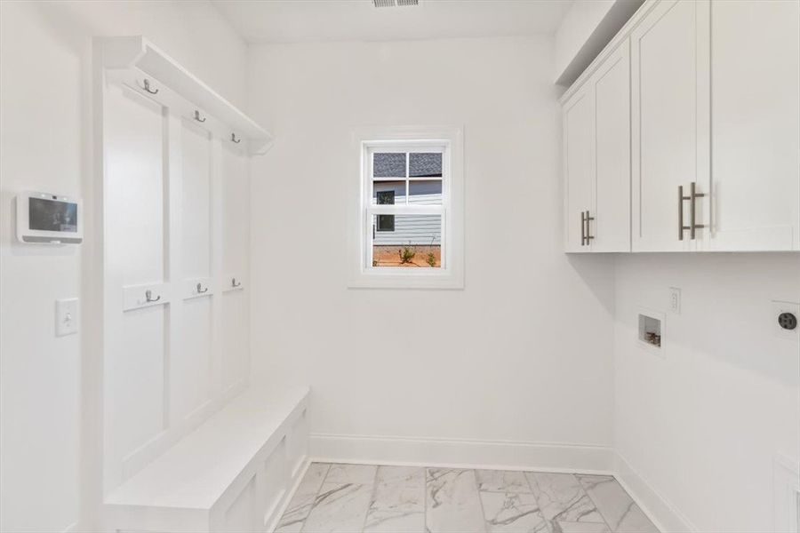 Functional mudroom built-ins and laundry hookups p