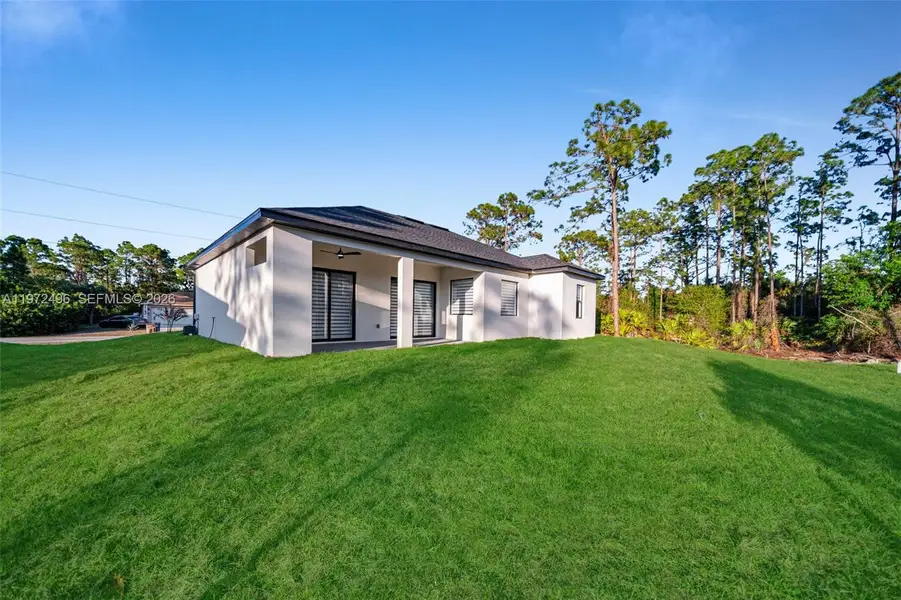 Exterior details and patio area of a home in , Lehigh Acres (Image 4).