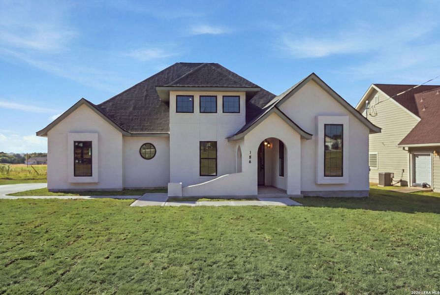 Front exterior of a new home in , Bandera, TX, highlighting curb appeal (Image 28). Front exterior of a new home in , Bandera, TX, highlighting curb appeal (Image 28).