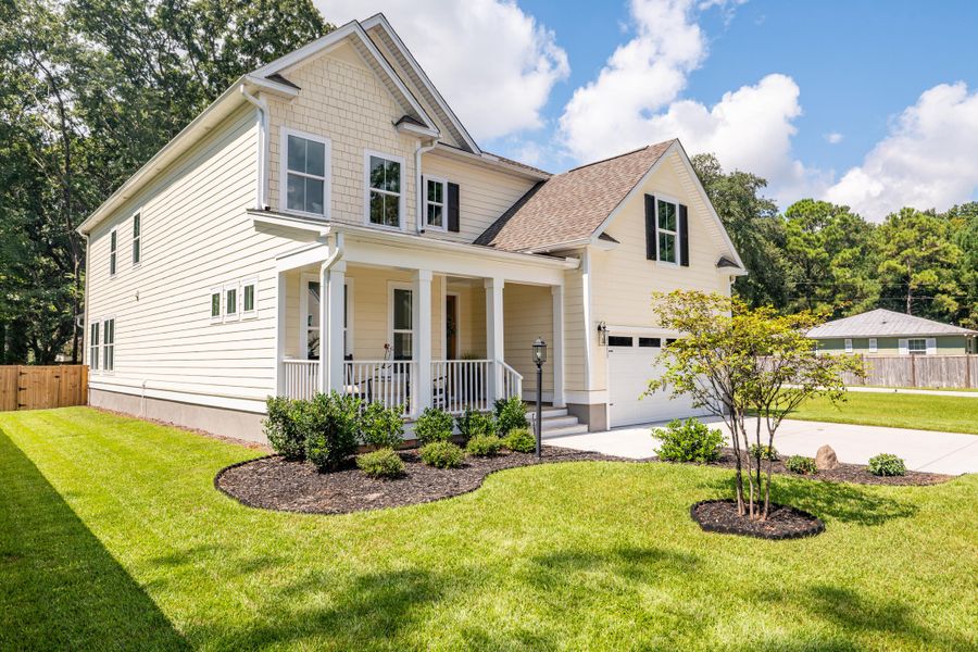 Front exterior of a new home in Overlook at Copahee Sound, Awendaw, SC, highlighting curb appeal (Image 32). Front exterior of a new home in Overlook at Copahee Sound, Awendaw, SC, highlighting curb appeal (Image 32).
