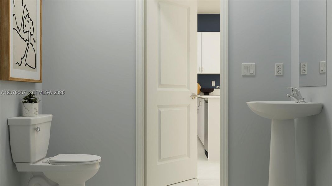 The powder room is tucked away off the living area for convenient access at any time of day. The powder room is tucked away off the living area for convenient access at any time of day.