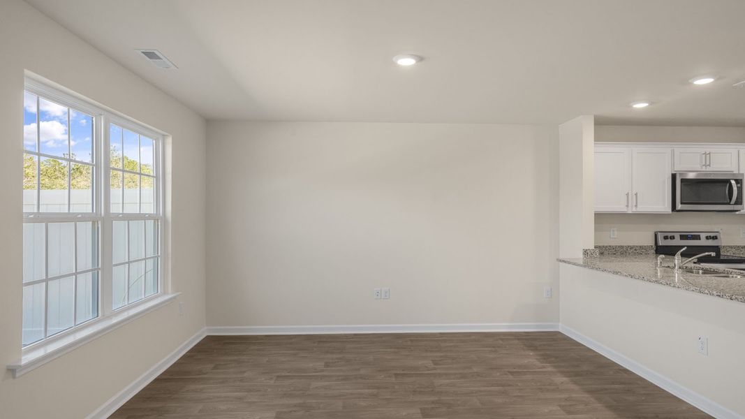 Representative unfurnished interior of a home built from the Pearson by D.R. Horton in The Townes at Ridgewood Farms, Winterville (Image 16).