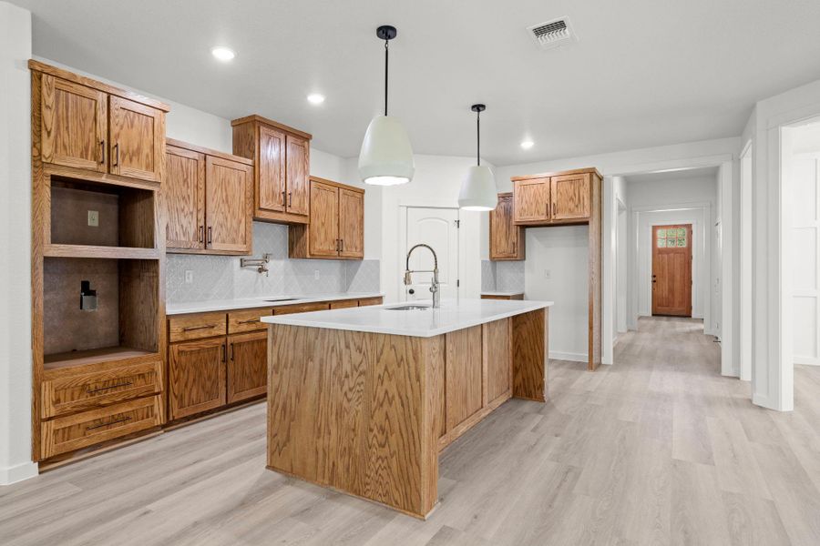 Custom cabinetry and generous counter space create a functional and stylish culinary haven. Custom cabinetry and generous counter space create a functional and stylish culinary haven.