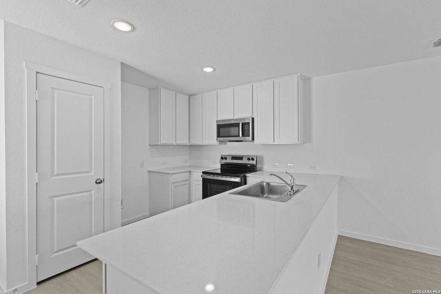 Furnished interior view inside a new home in Higdon Crossing, San Antonio (Image 9).