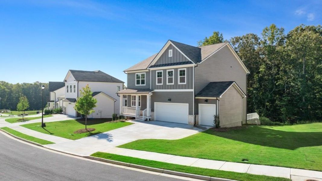 Front exterior of a new home in Falcon Landing, Gainesville, GA, highlighting curb appeal (Image 2).