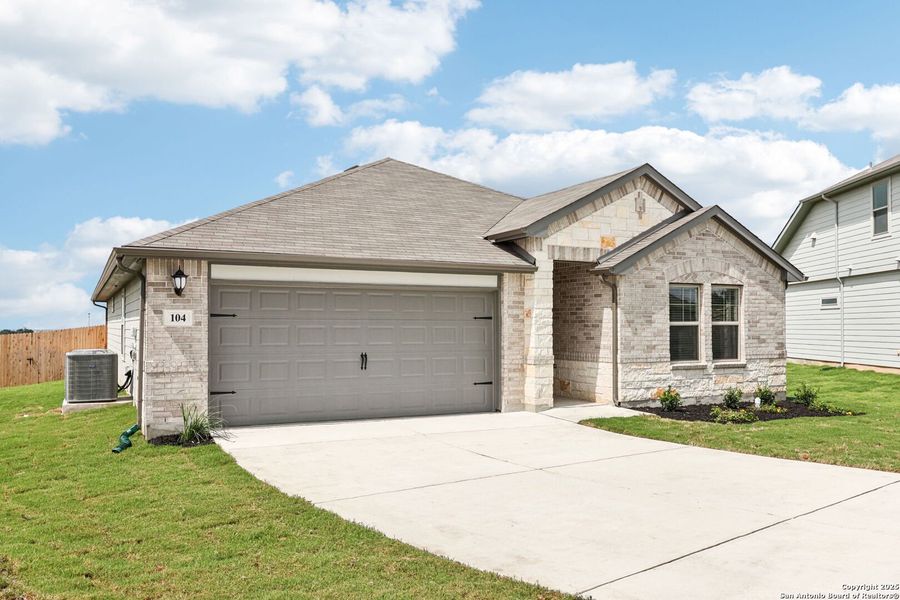 Front exterior of a new home in Legendary Trails - Classic Series, Cibolo, TX, highlighting curb appeal (Image 19).