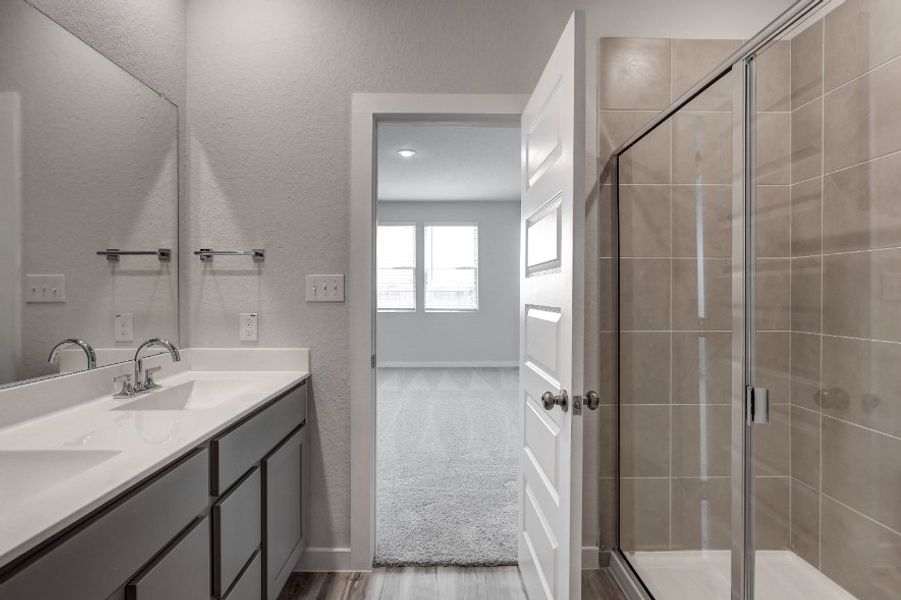 A bathroom with a glass shower.