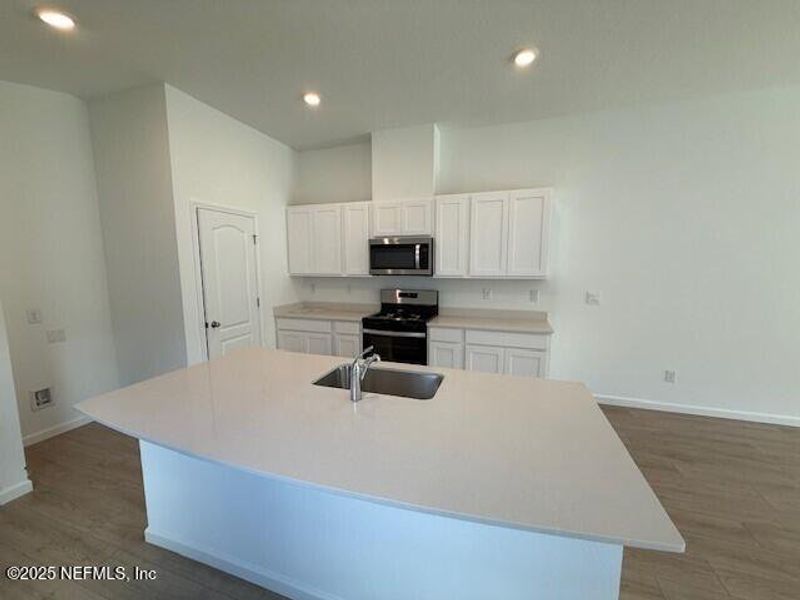 Furnished interior view inside a new home in Grand Reserve, Bunnell (Image 7).