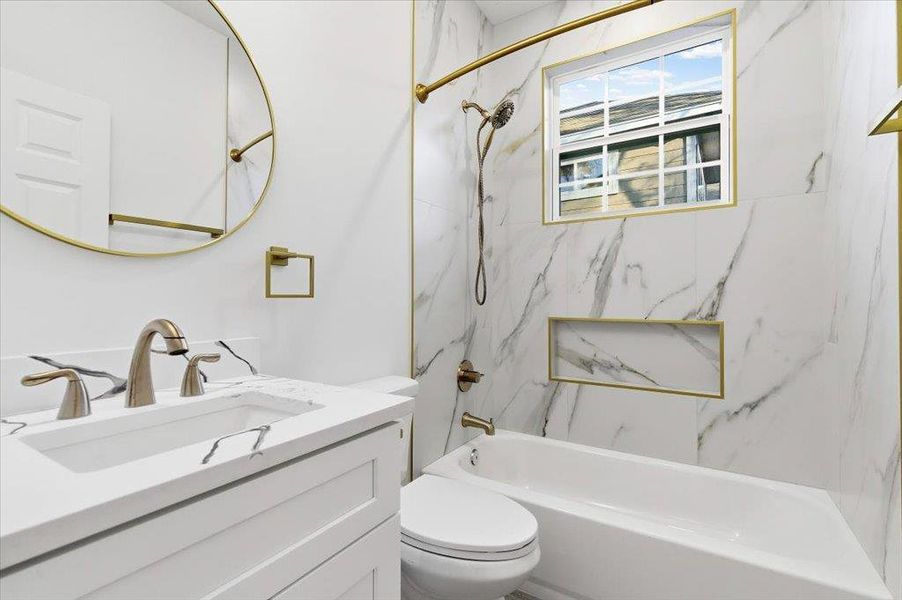 Full bath featuring vanity and shower / washtub combination