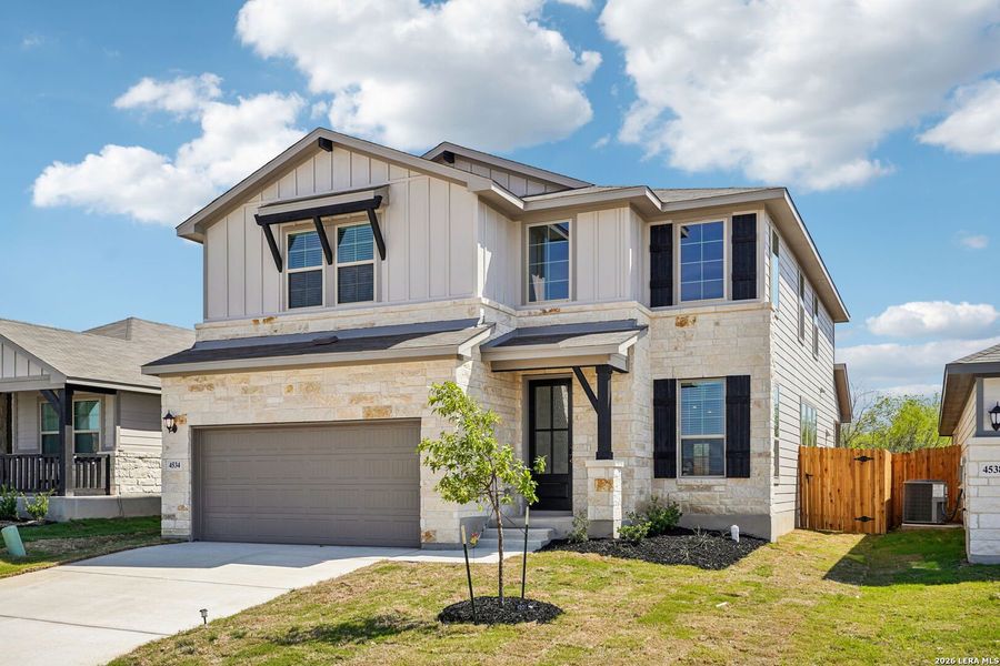 Front exterior of a new home in Remington Ranch, San Antonio, TX, highlighting curb appeal (Image 2). Front exterior of a new home in Remington Ranch, San Antonio, TX, highlighting curb appeal (Image 2).