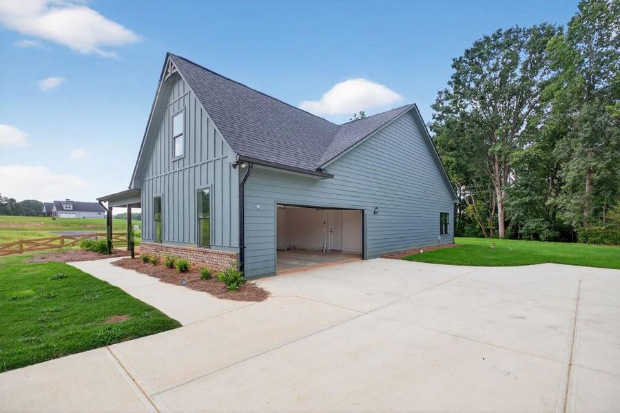 Front exterior of a new home in , Dallas, GA, highlighting curb appeal (Image 1).