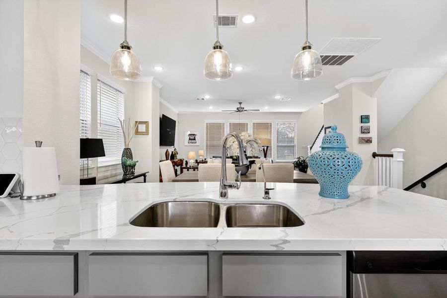 Spacious island with double sink and ample counter space, perfect for meal prep and entertaining guests. Spacious island with double sink and ample counter space, perfect for meal prep and entertaining guests.