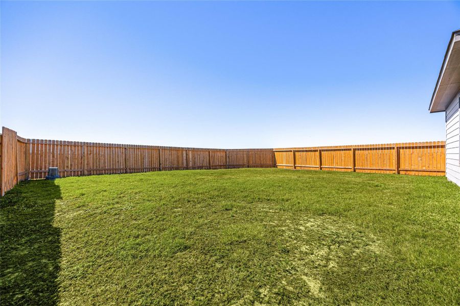 This expansive backyard provides ample space for gatherings, play, or creating your own outdoor oasis. This expansive backyard provides ample space for gatherings, play, or creating your own outdoor oasis.