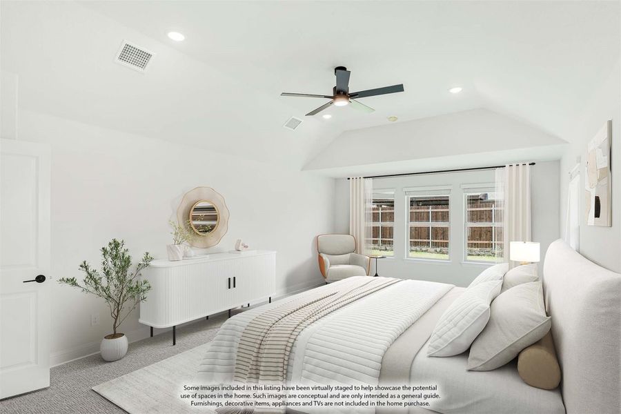 Bright bedroom with vaulted ceiling, ceiling fan, large windows, and white dresser with round mirror