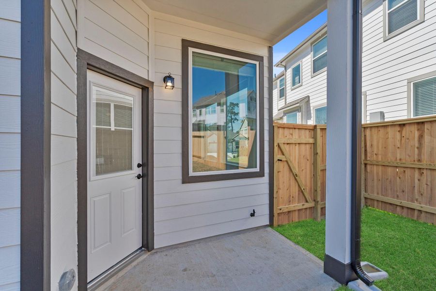 Exterior details and patio area of a home in Woodforest, Montgomery (Image 3).