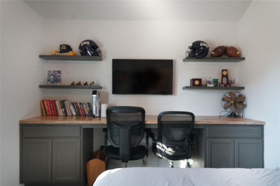 Bedroom with custom built in desk