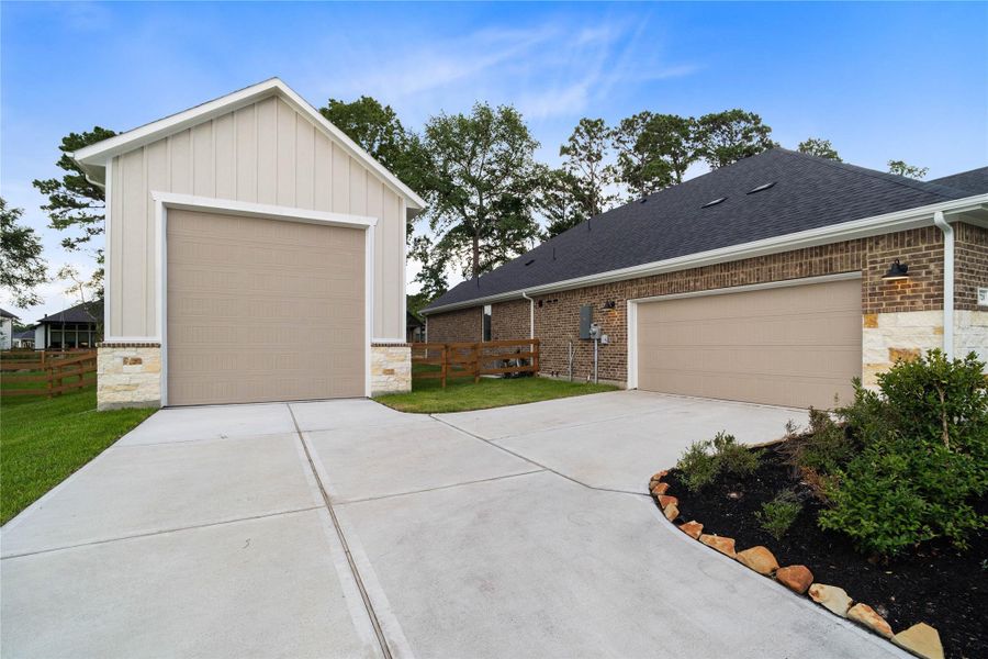 Front exterior of a new home in Timber Hollow, Magnolia, TX, highlighting curb appeal (Image 26).