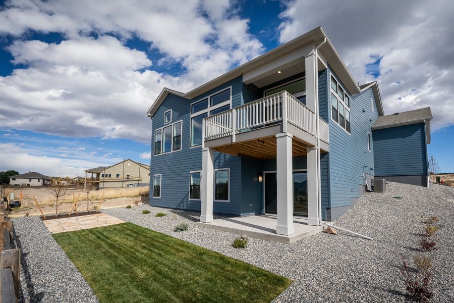 Exterior details and patio area of a home in Cloverleaf - Pinnacle Collection, Monument (Image 3).