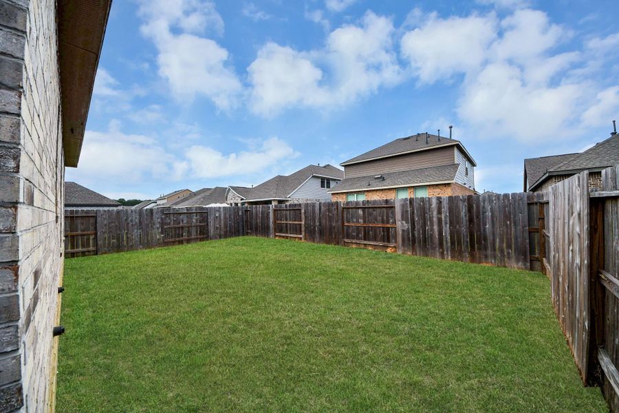 Exterior details and patio area of a home in The Trails, New Caney (Image 3).