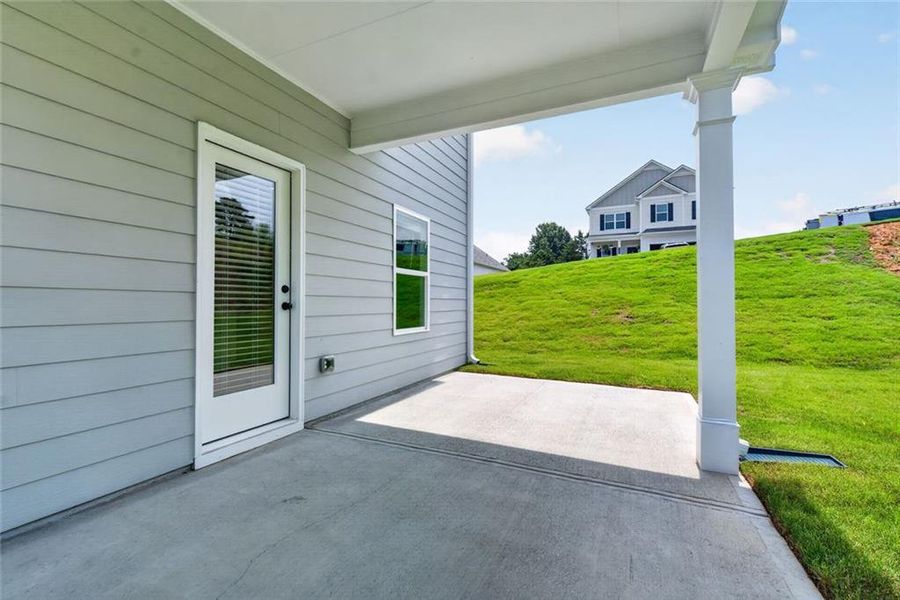 Exterior details and patio area of a home in Saddle Ridge, Calhoun (Image 20).