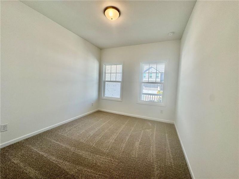 Spacious, unfurnished interior of a new home in Eastlyn Crossing, Flowery Branch (Image 15).