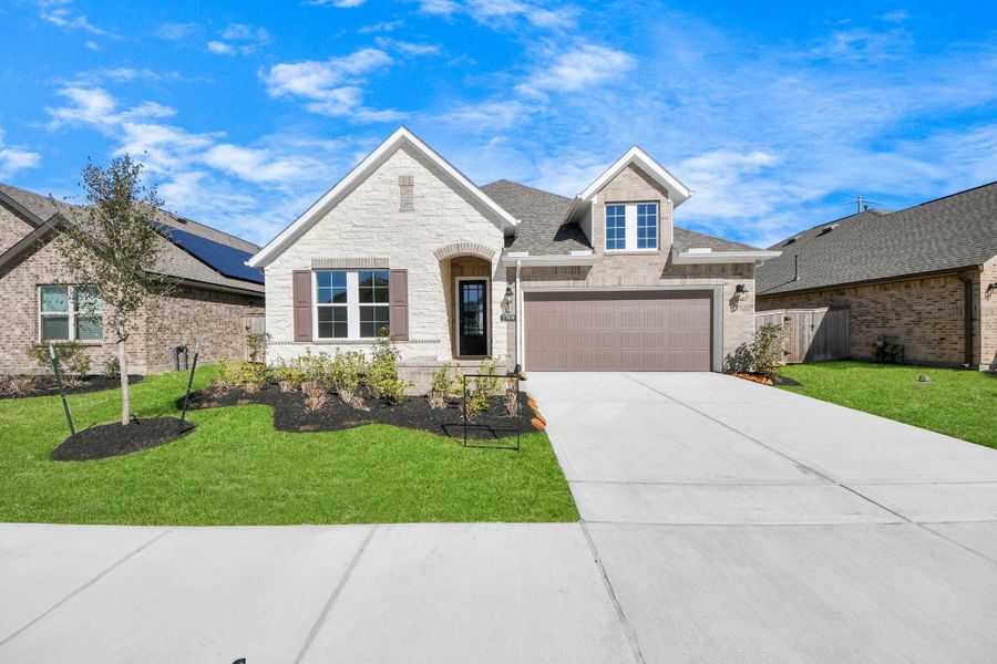 Front exterior of a new home in Bridgeland: Heritage Collection, Cypress, TX, highlighting curb appeal (Image 14). Front exterior of a new home in Bridgeland: Heritage Collection, Cypress, TX, highlighting curb appeal (Image 14).