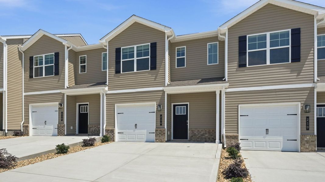 Front exterior of a new home in Cherokee Crossing, Kodak, TN, highlighting curb appeal (Image 2). Front exterior of a new home in Cherokee Crossing, Kodak, TN, highlighting curb appeal (Image 2).