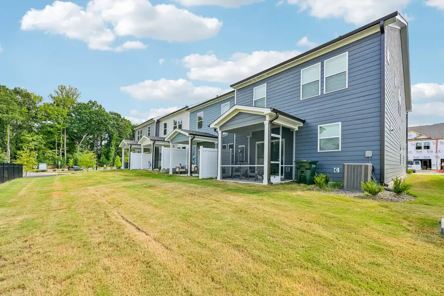 Exterior details and patio area of a home in Forestville Station, Wake Forest (Image 19).