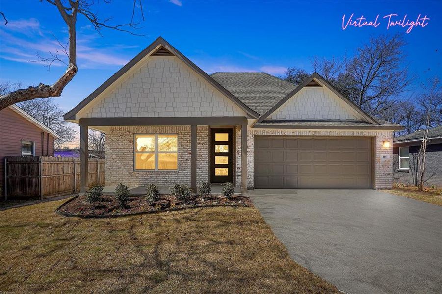 View of front facade with concrete driveway, a garage, fence, and brick siding