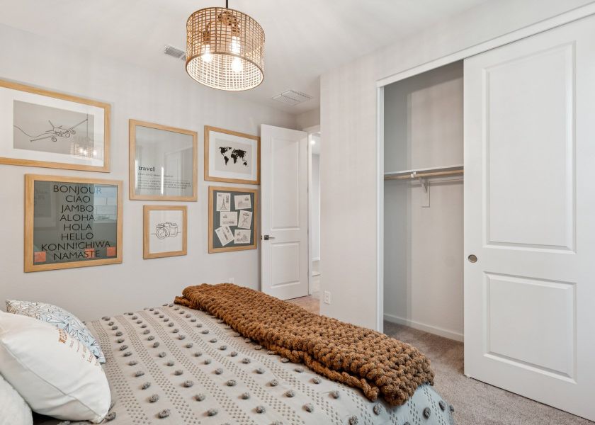 A bedroom with a bed and a lamp. A bedroom with a bed and a lamp.