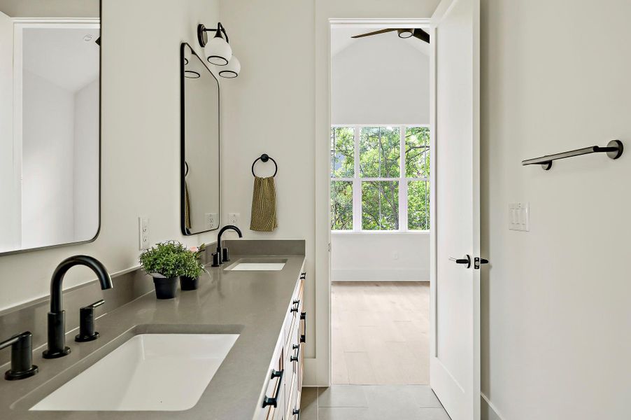Full bath featuring double vanity
