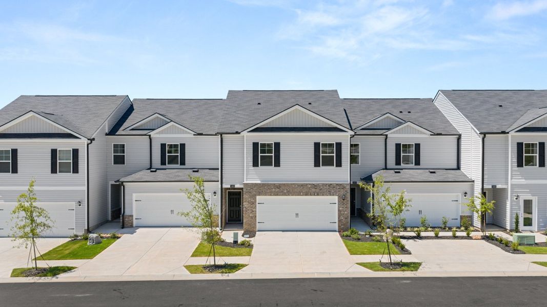 Front exterior of a new home in Rushing Waters Townhomes, North Augusta, SC, highlighting curb appeal (Image 1). Front exterior of a new home in Rushing Waters Townhomes, North Augusta, SC, highlighting curb appeal (Image 1).