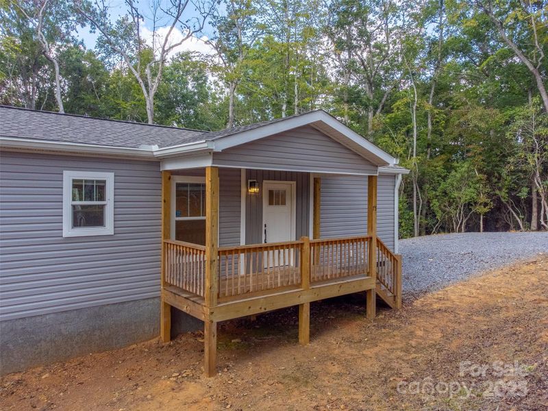 Exterior details and patio area of a home in , Hayesville (Image 24).