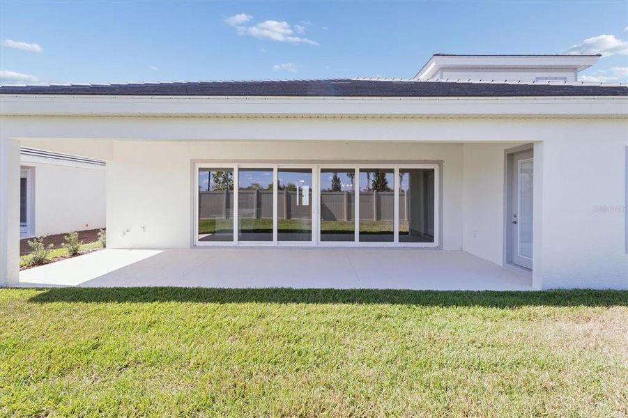 Exterior details and patio area of a home in Oakfield, Parrish (Image 25).