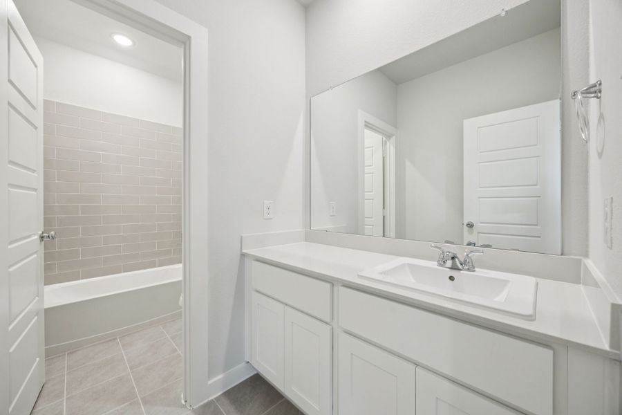 Bathroom in the Masters home plan by Trophy Signature Homes – REPRESENTATIVE PHOTO