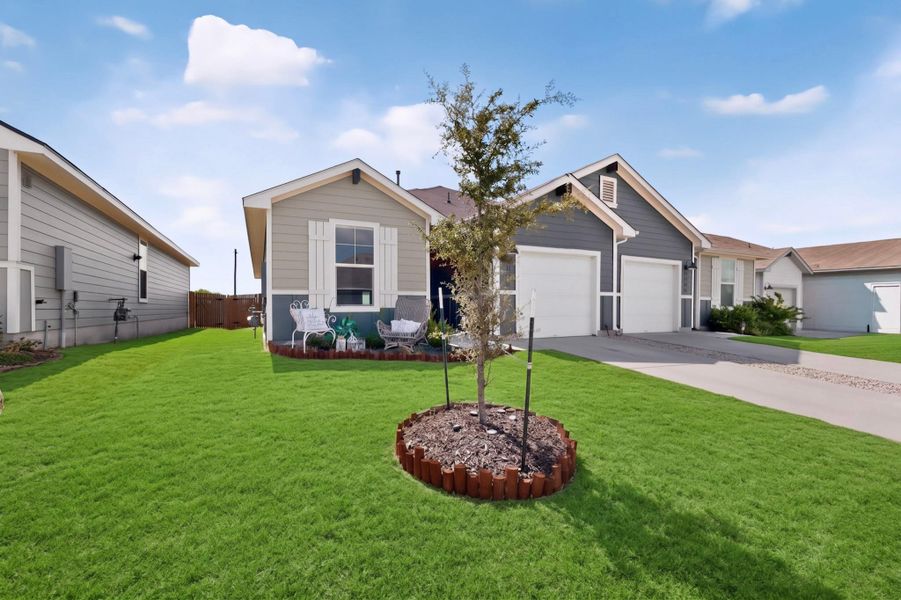 Neat siding and dual garages define this contemporary suburban home with a manicured front lawn. Neat siding and dual garages define this contemporary suburban home with a manicured front lawn.