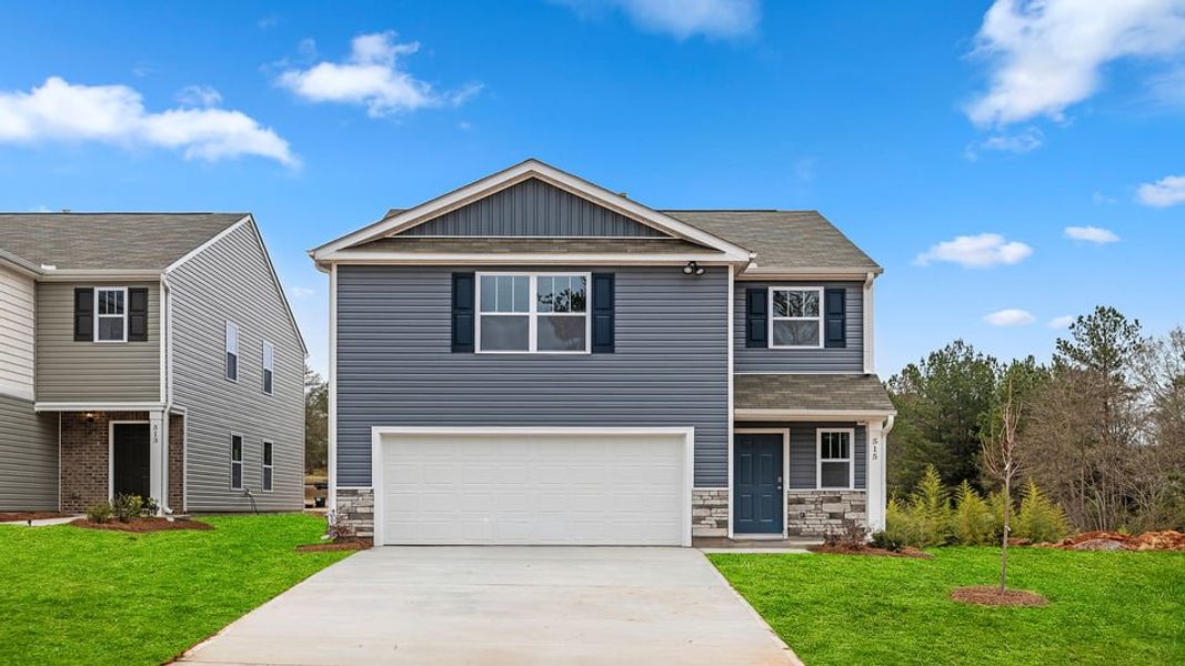 Front exterior of a new home in Durbin Meadows, Fountain Inn, SC, highlighting curb appeal (Image 1). Front exterior of a new home in Durbin Meadows, Fountain Inn, SC, highlighting curb appeal (Image 1).