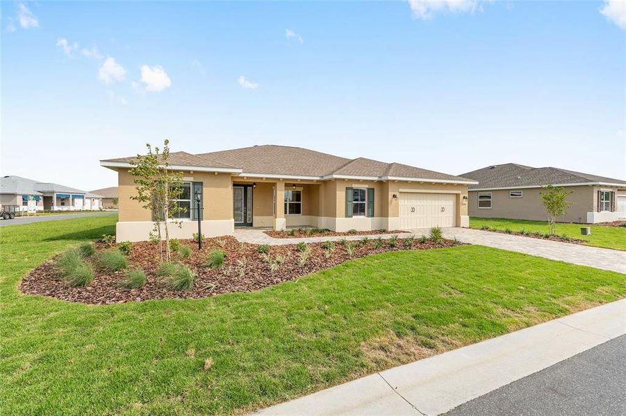 Front exterior of a new home in On Top of the World Communities, Ocala, FL, highlighting curb appeal (Image 14).