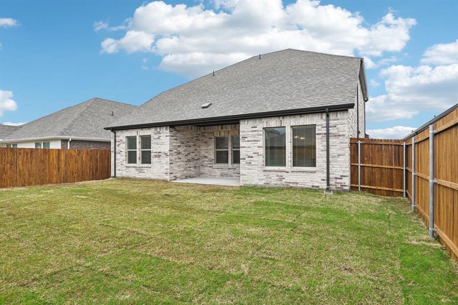 Exterior details and patio area of a home in Parks at Foster Crossing - Signature Series, Anna (Image 3).