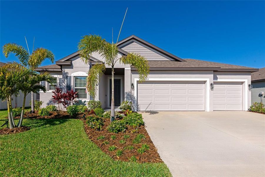 Front exterior of a new home in , Bradenton, FL, highlighting curb appeal (Image 23).