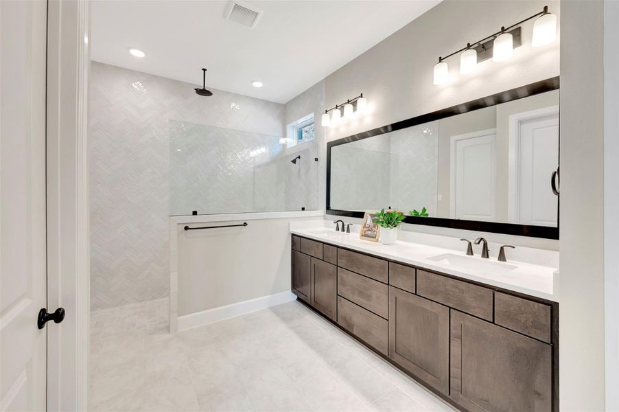 Beautiful Master bath with walk in shower with 2 shower heads and lots of drawers at extra long vanity!